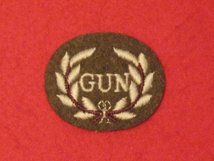 NUMBER 2 DRESS FAD CROSSED GUN BARREL BADGE