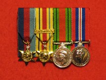 MINIATURE COURT MOUNTED 1939 45 STAR - AFRICA STAR WITH NORTH AFRICA CLASP - DEFENCE AND END OF WAR MEDALS