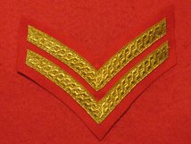 MESS DRESS 2 BAR CORPORAL CHEVRON GOLD ON SCARLET BADGE