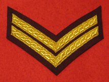 MESS DRESS 2 BAR CORPORAL CHEVRON GOLD ON MAROON BADGE