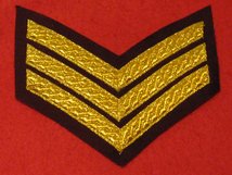 MESS DRESS 3 BAR SERGEANT CHEVRON GOLD ON MAROON BADGE. 