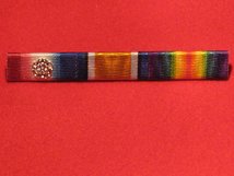 1914 STAR WITH ROSETTE AND BRITISH WAR MEDAL AND VICTORY MEDAL RIBBON BAR PIN ON