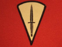 COMMANDO DAGGER ON CREAM BADGE